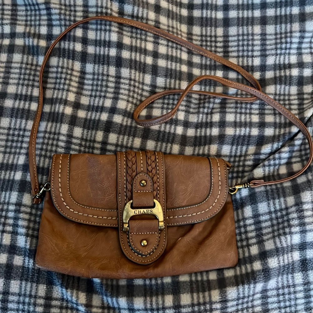 Tan chaps cross body.